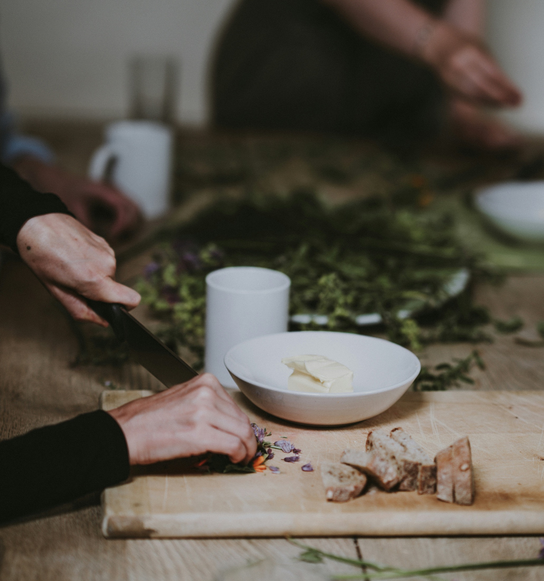 A cook preparing food by hand